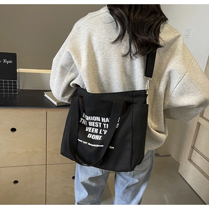 Large black canvas tote bag with white graphic print for student casual daily use