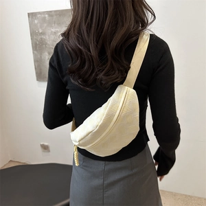 Minimalist light yellow woven crossbody chest bag for women with adjustable strap
