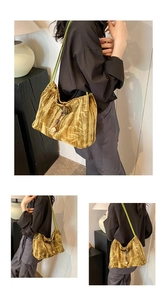 Detailed close-up of mustard yellow velvet tote bag with bamboo texture and wooden cube charm