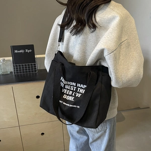 Sac fourre-tout en toile noire pour femme avec imprimé minimaliste et bandoulière réglable
