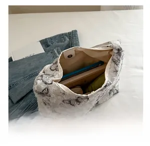 Internal view of large capacity butterfly tote bag with magnetic clasp and daily essentials