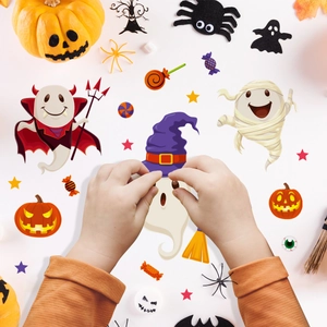 Close-up of DIY Halloween stickers featuring cute pumpkins, ghosts and bats on white background