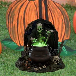 Spooky Halloween skull wizard garden stake with glowing cauldron and skull base decoration