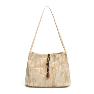 Chic beige velvet shoulder bag with bamboo leaf pattern and wood bead drawstring