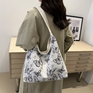 Chic butterfly print canvas tote bag for women with a large capacity shoulder design