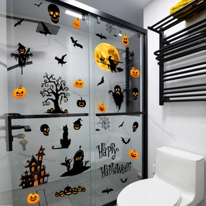Halloween window stickers featuring pumpkin, bat and wizard motifs on glass doors