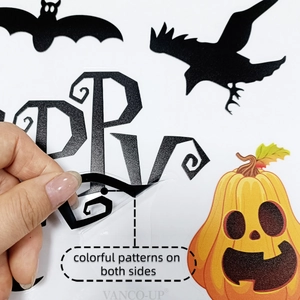 Detail showing double-sided Halloween static window clings with bats and pumpkin patterns