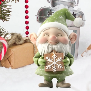 Close-up of a 3D Christmas gnome with green hat holding a snowflake gift box decor