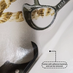 Detail showing self-adhesive backing of bloody knife Halloween wall sticker