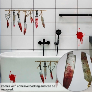 Detail of bloody knife wall stickers on bathroom tiles with adhesive backing demo