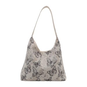Minimalist canvas tote bag with butterfly prints and spacious interior for women