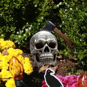 Halloween garden stake skull decoration with axe detail for yard path ornaments