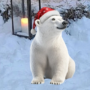 Detailed view of a white polar bear garden stake with red Christmas hat in snowy yard