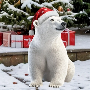 Close-up of a festive polar bear garden stake with red Christmas hat and snow texture