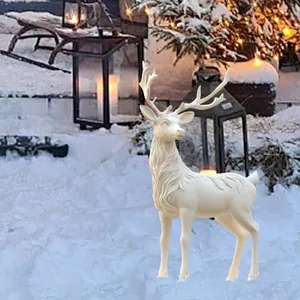 White reindeer garden stake decoration with detailed fur texture and antlers in snow scene
