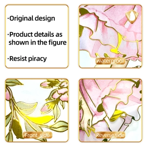 Detail of waterproof gold foil wall sticker with pink flowers and lace patterns