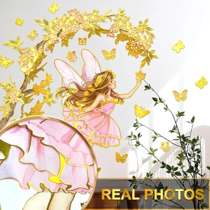 Detail showing the golden metallic edges and embossed texture of fairy wall stickers