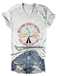 Detail of V-neck white cotton T-shirt featuring vintage desert highway graphic print