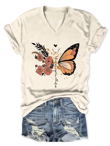 Close-up of 'There is magic' print on a V-neck T-shirt paired with distressed denim shorts