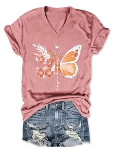 Detail of pink V-neck T-shirt with butterfly print and blue denim shorts set