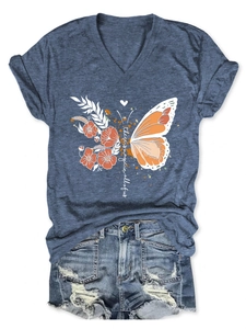 Detail of blue V-neck T-shirt with butterfly print and ripped denim shorts set
