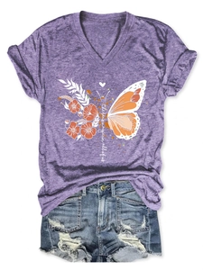 Detail of purple V-neck T-shirt with magic butterfly print and distressed denim shorts
