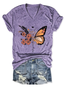 Flat lay of heather purple V-neck T-shirt with magic butterfly print and denim shorts