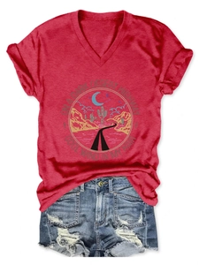 Detail of red V-neck T-shirt with vintage desert graphic and distressed denim shorts