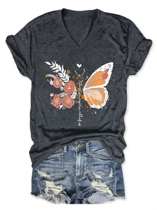 Detail of dark grey V-neck T-shirt featuring magic floral butterfly print with denim shorts