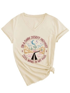 Detail of V-neck beige t-shirt with knotted hem and desert landscape print graphic