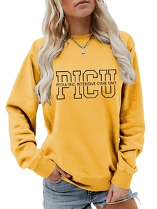 Detail of PICU Pediatric Intensive Care Unit lettering on ginger yellow sweatshirt