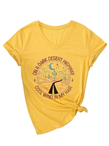 Detail of the V-neckline and vintage desert graphic on a yellow short-sleeve tee