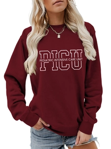 Close-up of PICU Pediatric print on burgundy crewneck sweatshirt with ribbed cuffs