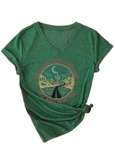 Detail of V-neck dark green T-shirt with vintage desert graphic and knotted hem