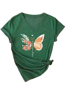 Detail of green V-neck T-shirt with floral butterfly print and stylish front hem knot