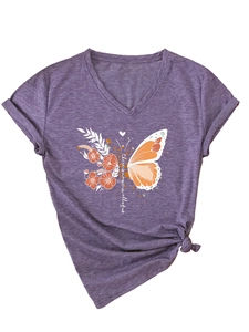 Detail of purple V-neck T-shirt featuring floral butterfly print and magic quote