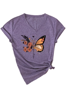 Detail of V-neck T-shirt showing floral butterfly print and stylish knotted hem