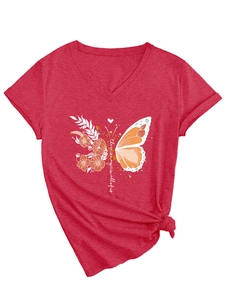 Detail of red V-neck T-shirt showing butterfly print and there is magic text with knot hem