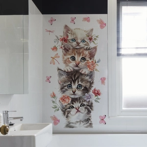 Cartoon cats and flowers wall decal on white bathroom tiles with sink scenery