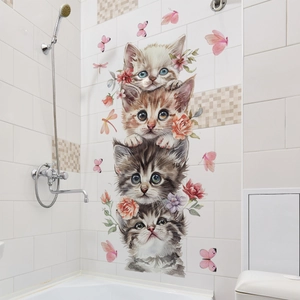 Watercolor stacked cats with flowers and butterflies wall decal in a bathroom setting