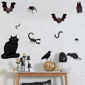 Halloween wall stickers featuring black cats bats and spiders on a white brick wall