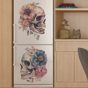 Detail of vintage skull and floral wall decals on a white refrigerator surface