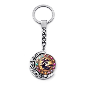 Detail of Halloween witch on broom rotating pendant with crescent moon and shiny gems