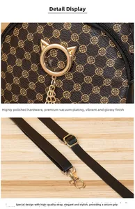 Détail de la ferrure chat dorée et du motif trèfle sur le sac à dos rétro en cuir