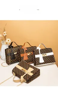 Close-up of stylish mini crossbody bags with gold hardware and geometric patterns
