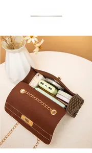 Brown corduroy crossbody bag interior detail showing storage for daily essentials