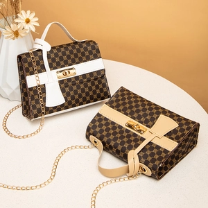 Chic monogram print Kelly bag with gold buckle and chain strap in white and apricot