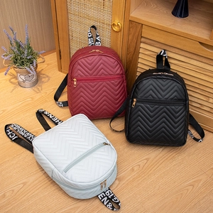 Chic quilted wave-pattern mini backpacks in burgundy, black, and blue with trendy webbing