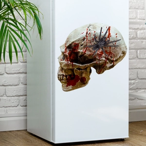 Détail d'autocollant mural tête de mort Halloween avec éclaboussures de sang sur frigo