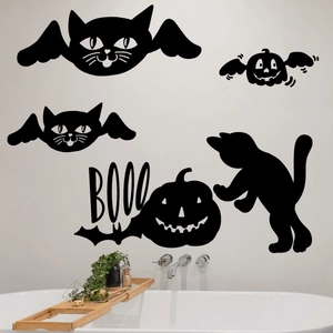 Halloween wall sticker set featuring black winged cat and pumpkin silhouette on a bathroom wall